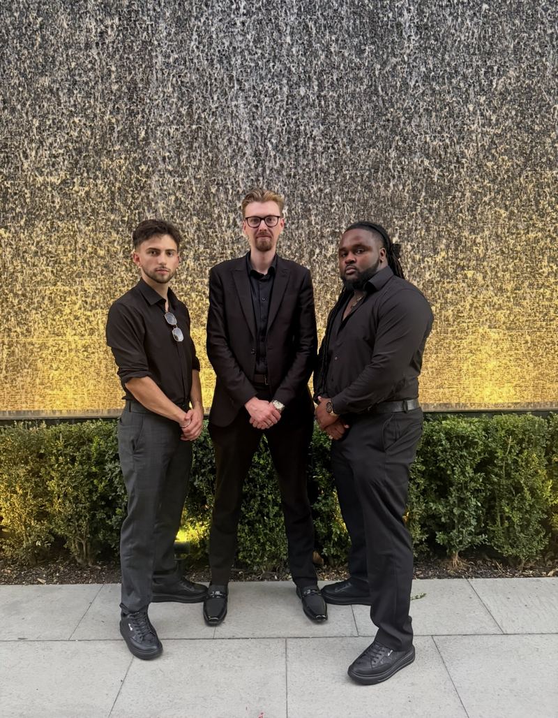 Three LY Marketing team members at an evening event