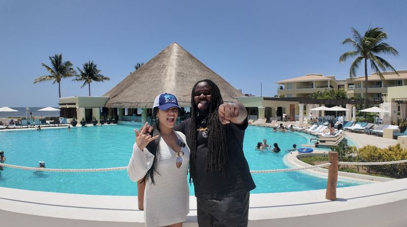 LY Marketing team members celebrating at a tropical resort