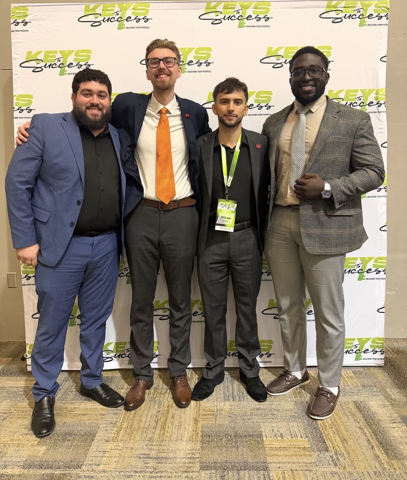 Four LY Marketing professionals at an industry conference