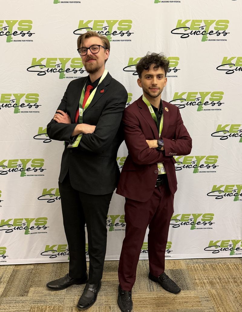 Two LY Marketing team members at a sales conference