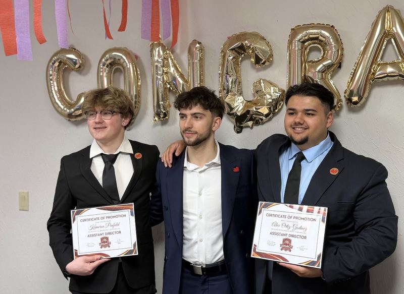 Three LY Marketing team members holding promotion certificates